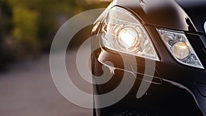 Modern luxury car headlights closeup.