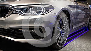 Modern luxury car, headlights closeup. Concept of expensive, sports auto.