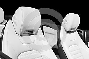 Modern Luxury car inside. Interior of prestige modern car. Comfortable leather seats. Perforated leather with isolated Black backg