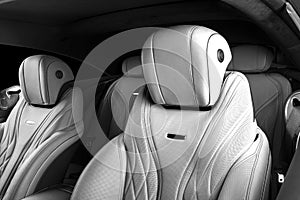 Modern Luxury car inside. Interior of prestige modern car. Comfortable leather seats. Perforated leather. Modern car interior deta