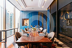 Modern luxury decorated VIP dining room interior restaurant that can view Bangkok cityscape. Elegant design for fine dining