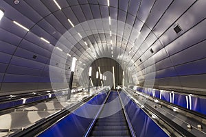 Modern luxury escalator - moving staircase at train station