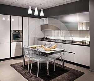 Modern luxury fitted kitchen with center table