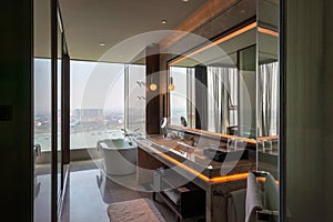 Modern luxury hotel room interior, bathroom and bathtup