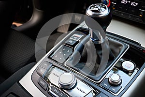 Modern luxury interior engine start stop button shift gear of manual gearbox and Multi Media Interface controls