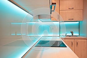 Modern luxury kitchen with blue LED lighting photo