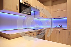 Modern luxury kitchen with purple LED lighting