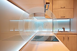 Modern luxury kitchen with white LED lighting photo