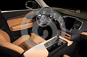 Modern luxury prestige car interior, dashboard, steering wheel.