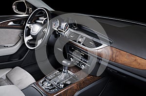 Modern luxury prestige car interior, dashboard, steering wheel.