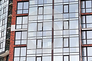 Modern luxury residential building with large windows. Exterior view of new multifamily residential building