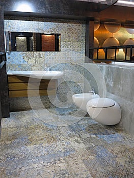 Modern luxury restroom toilet, mirror and bidet in bathroom