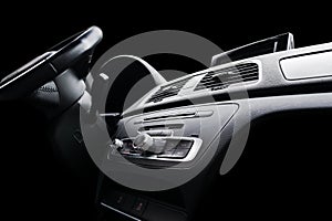 Modern Luxury sport car inside. Interior of prestige car. Black Leather. Car detailing. Dashboard. Media, climate and navigation c