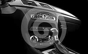 Modern Luxury sport car inside. Interior of prestige car. Black Leather. Car detailing. Dashboard. Media, climate and navigation c