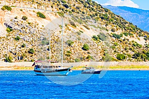 Modern luxury yacht and motor boat at the harbor. Summer vacation