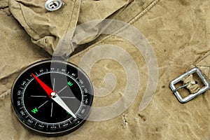 Modern Magnetic Compass On The Weathered Backpack