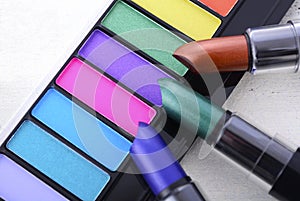 Modern makeup lipstick and eye shadow color range.