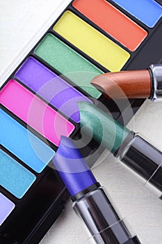 Modern makeup lipstick and eye shadow color range.