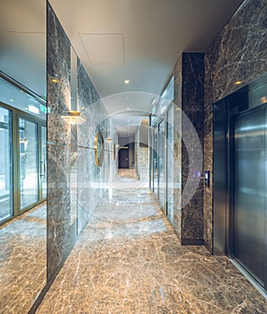 Modern marble interior of entrance hall in luxury residential building