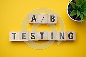 Modern marketing buzzword - A and B testing. Top view on wooden table with blocks. Top view