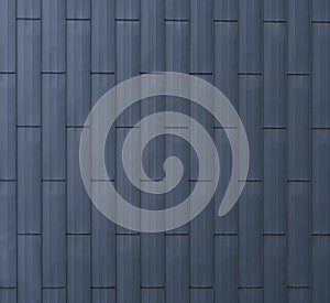 Modern materials in the construction industry. Texture of metal cladding of a building facade closeup.