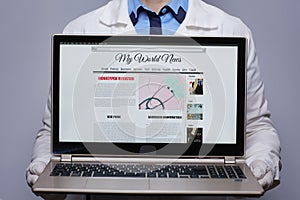 Modern medical doctor woman showing laptop with monkeypox news