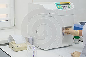 Modern medical laboratory with test analyzers.