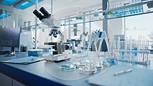 Modern Medical Research Laboratory with Microscope and Test Tubes with Biochemicals on the Desk. S