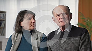 modern medicine, elderly married couple feeling unwell consult doctor online via video link laptop, look at camera