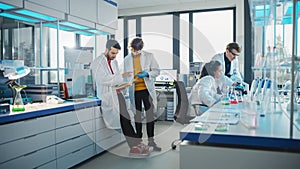 Modern Medicine Laboratory: Diverse Team of Multi-Ethnic Young Scientists Analysing Test Samples