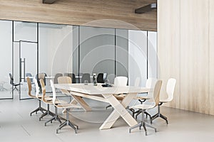 Modern meeting room interior with table and chairs, decorative objetcs.