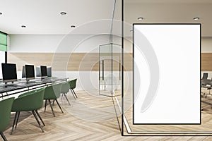 Modern meeting room office interior with furniture, empty white frame on wall, wooden flooring, equipment and daylight. Mock up,