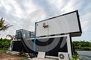 Modern metal building made from shipping containers and blue sky background