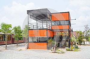 Modern metal building made from shipping house containers and blue sky background