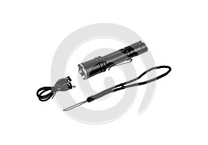 Modern metal LED flashlight in black color. Portable flashlight isolate on a white back