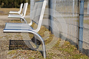 Modern metal benches in park