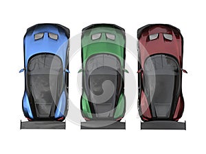 Modern metallic sports cars - red, green and blue - top view