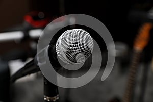 Modern microphone at recording studio, closeup with space for text. Music band practice