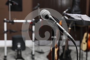 Modern microphone at recording studio, space for text. Music band practice