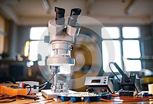 Modern microscope, connectors component and large green microcircuit in workshop laboratory