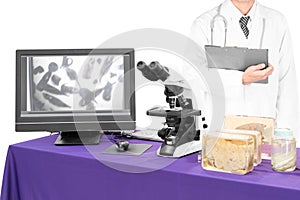 Modern microscope with a doctor with liver fluke