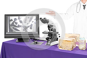 Modern microscope with a doctor with liver fluke