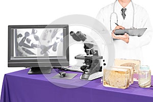 Modern microscope with a doctor with liver fluke photo