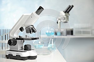Modern microscope on table in laboratory. Medical equipment