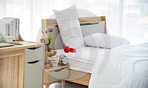 The modern or minimal interior bedroom design decorated with comfortable  double bed, white bedding
