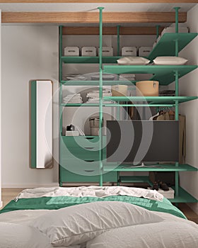 Modern minimalist bedroom in turquoise tones with walk-in closet, close up, bed with duvet and pillows. Chest of drawers, hangers