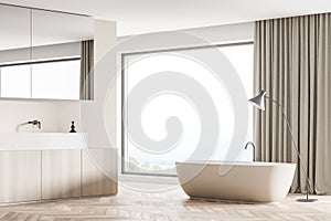 Modern minimalist panoramic bathroom with beige bathtub and floor lamp. Corner view