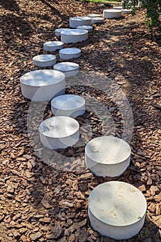 modern minimalist path of round stones in the Park leading on th