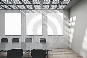 Modern minimalistic concrete and wooden meeting room interior with mock up frames on wall, window shadows and white table. Law,