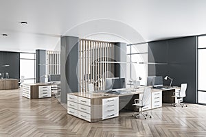 Modern minimalistic eco style openspace office with dark wood parquet, wooden furniture, dark walls, white chairs, huge windows